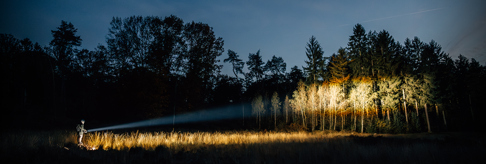 Man with a bright search light