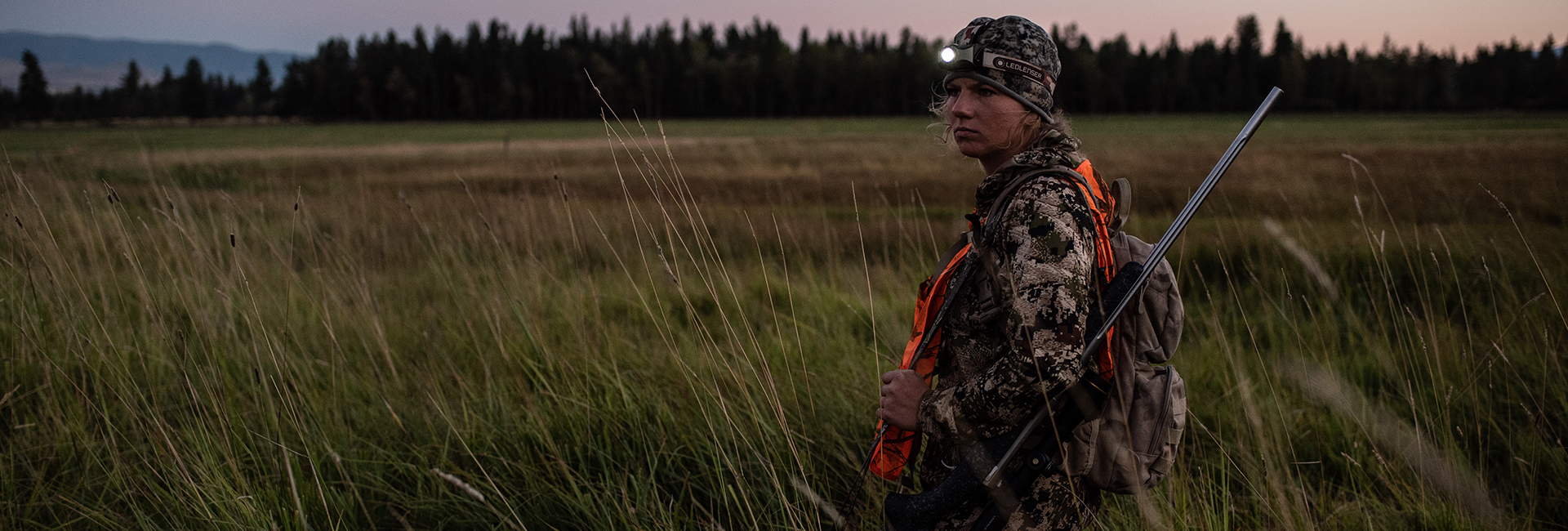 A hunting woman with a headlamp