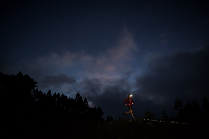 Runner in the night with a headlamp