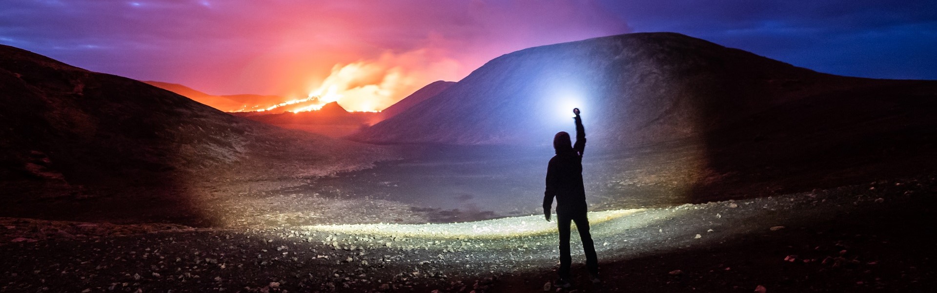 A man with a large and bright flashlight